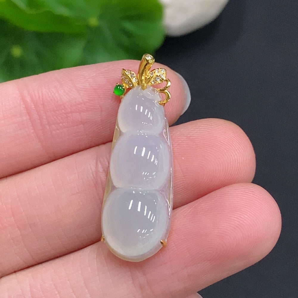 Huiliu Jadeite Lucky Bean Pendant with diamond accents, crafted from green jade, featuring a polished, carved design.