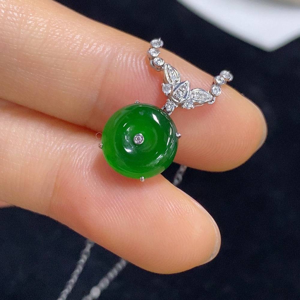HUILIU HQ jadeite peace knot pendant set with diamond accents and chain, showcasing polished green jade and sparkling gemstones.