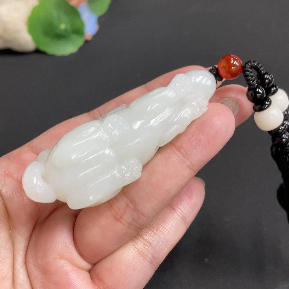 Hetian jade pendant featuring an auspicious beast design with non-Hetian jade beads and a rope, weighing approximately 65.3g.