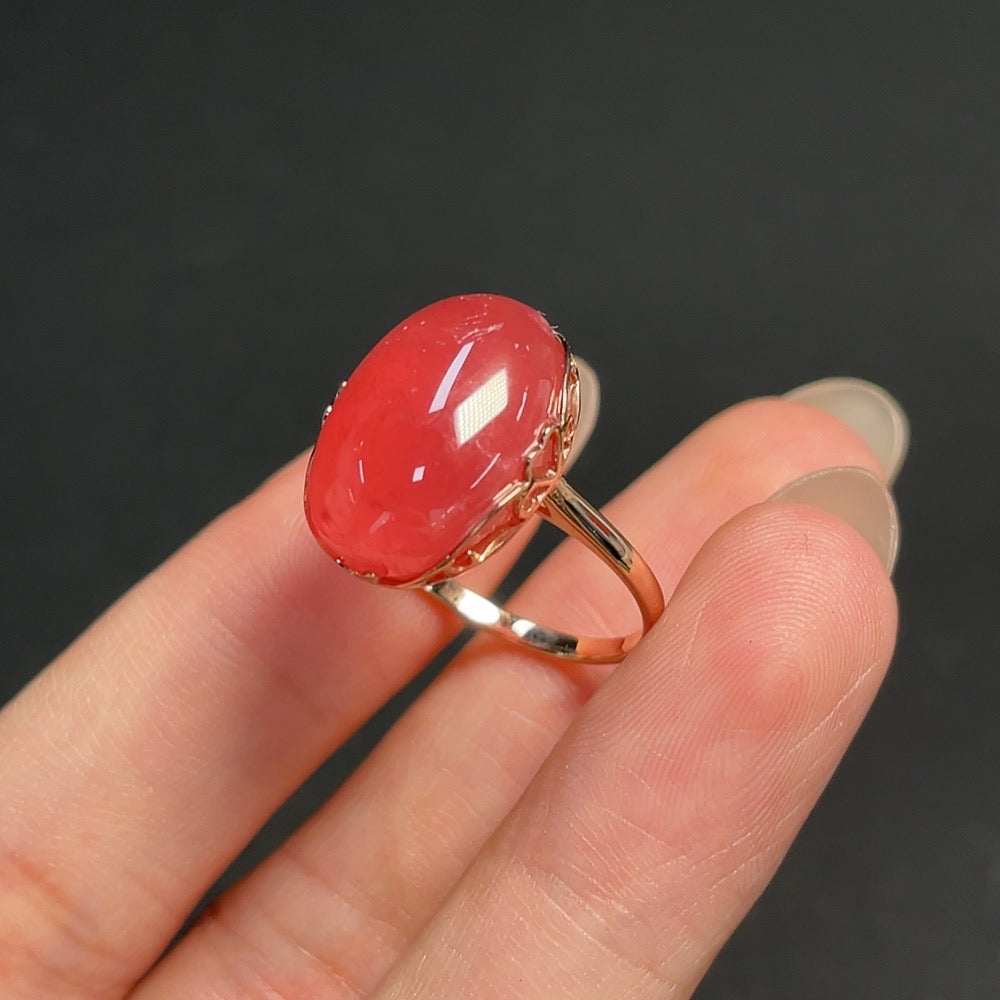 Rhodochrosite inlaid gemstone ring with 18K gold band and 9K gold setting, size 15, featuring visible organic matter.