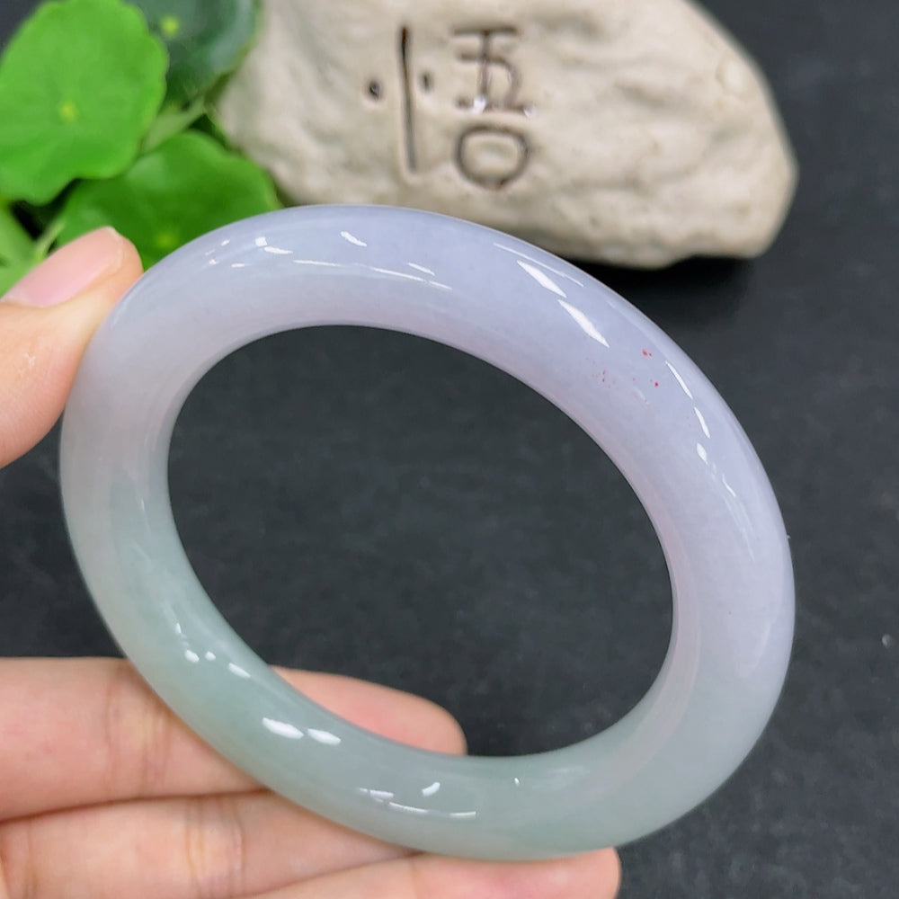 HKHQ jadeite round bangle in size 57.1 with a polished surface, weighing 70.28g, displayed on a neutral background.