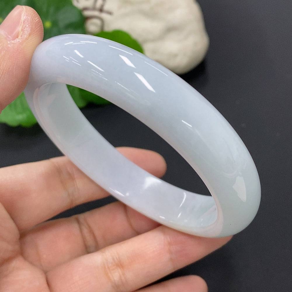 Huiliu certified jadeite round bangle with smooth, polished surface, showcasing the elegant, natural green jade color.