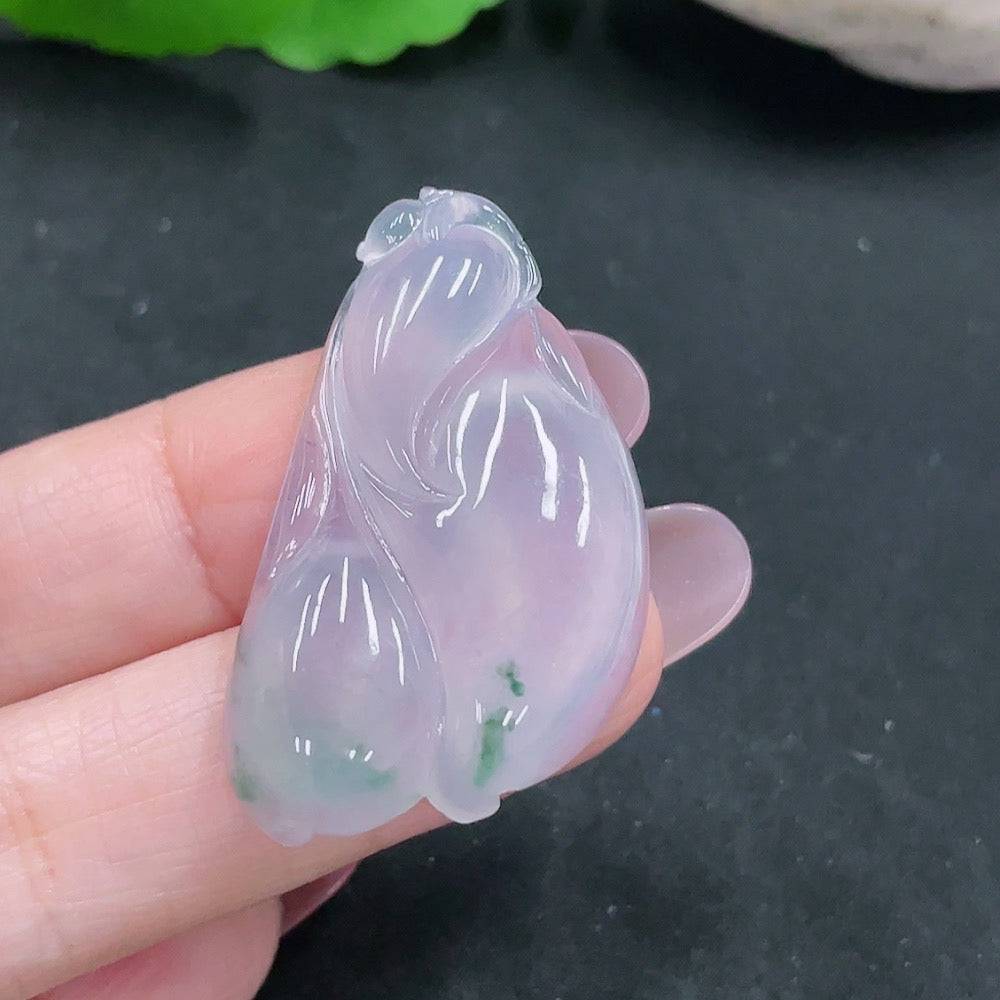 Huiliu Jadeite pendant featuring a polished, green jade gemstone with intricate details, certified by Huiliu HQ.