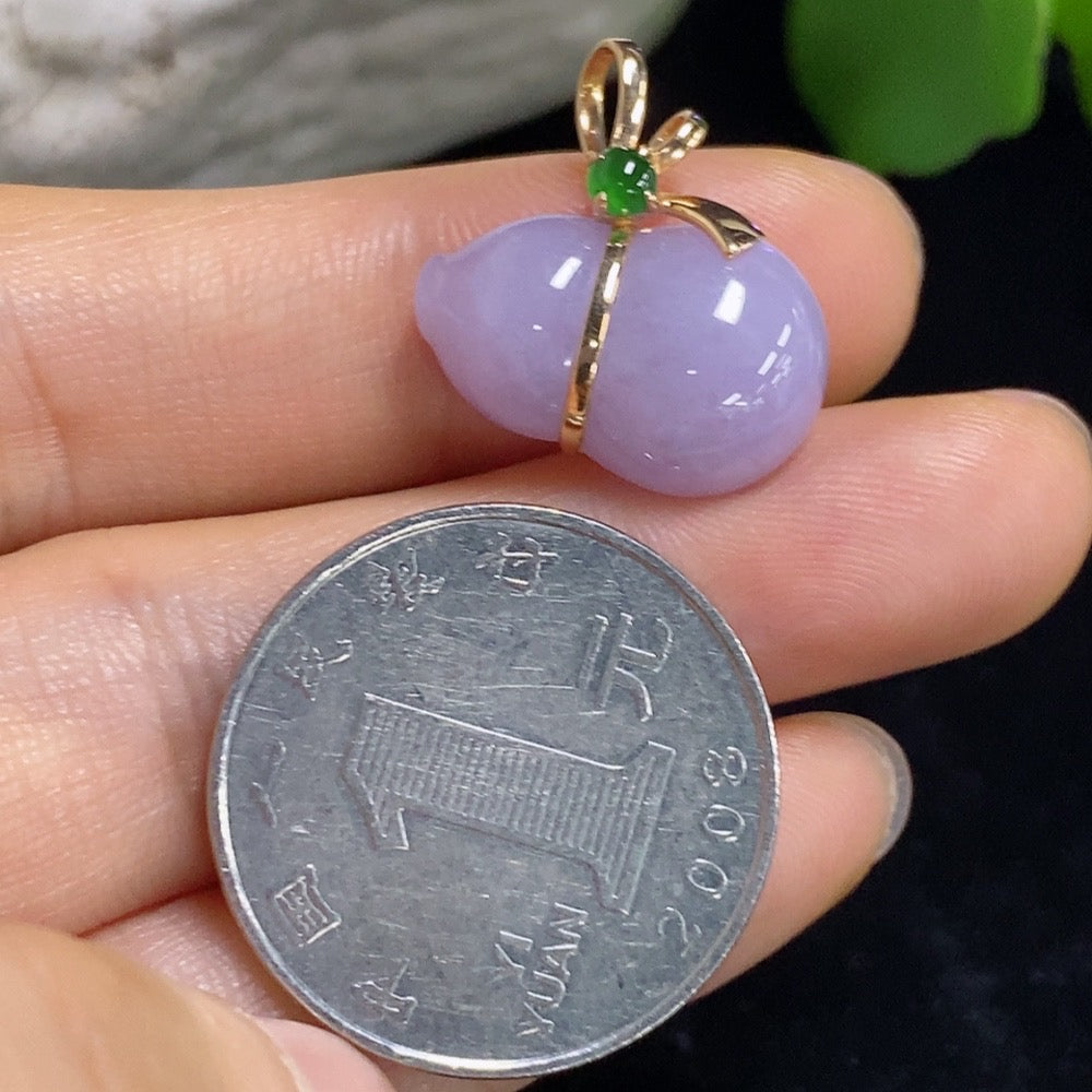 Jadeite gourd inlaid pendant on a necklace, crafted with 18K gold, showcasing intricate design and smooth polished surface.