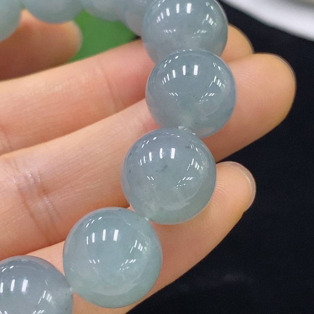 Jadeite bracelet with 13mm beads from HUILIU HQ, showcasing smooth jade stones in a stylish design.