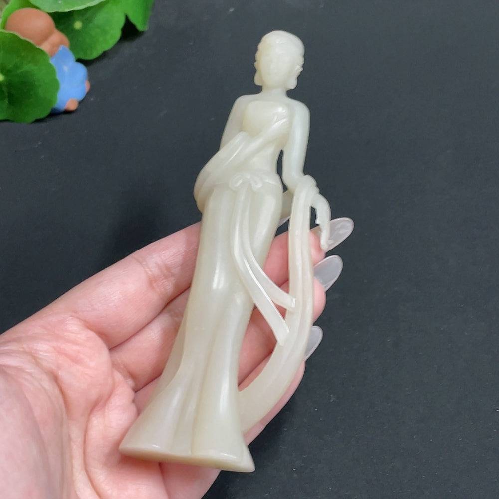 Huiliu certified Hetian jade ornament featuring intricate jade craftsmanship and natural green hues, showcasing traditional beauty.