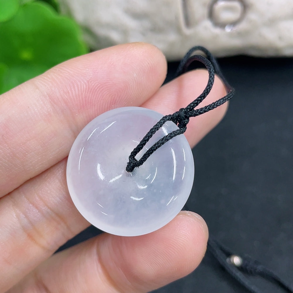 Jadeite pendant weighing approximately 6.8g on a necklace, featuring vibrant green jadeite stone, from HKHQ.