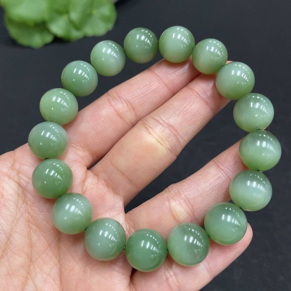 Hetian Jade Jasper bracelet with 11.7mm beads, weighing approximately 44.6g, featuring smooth, polished jade stones.