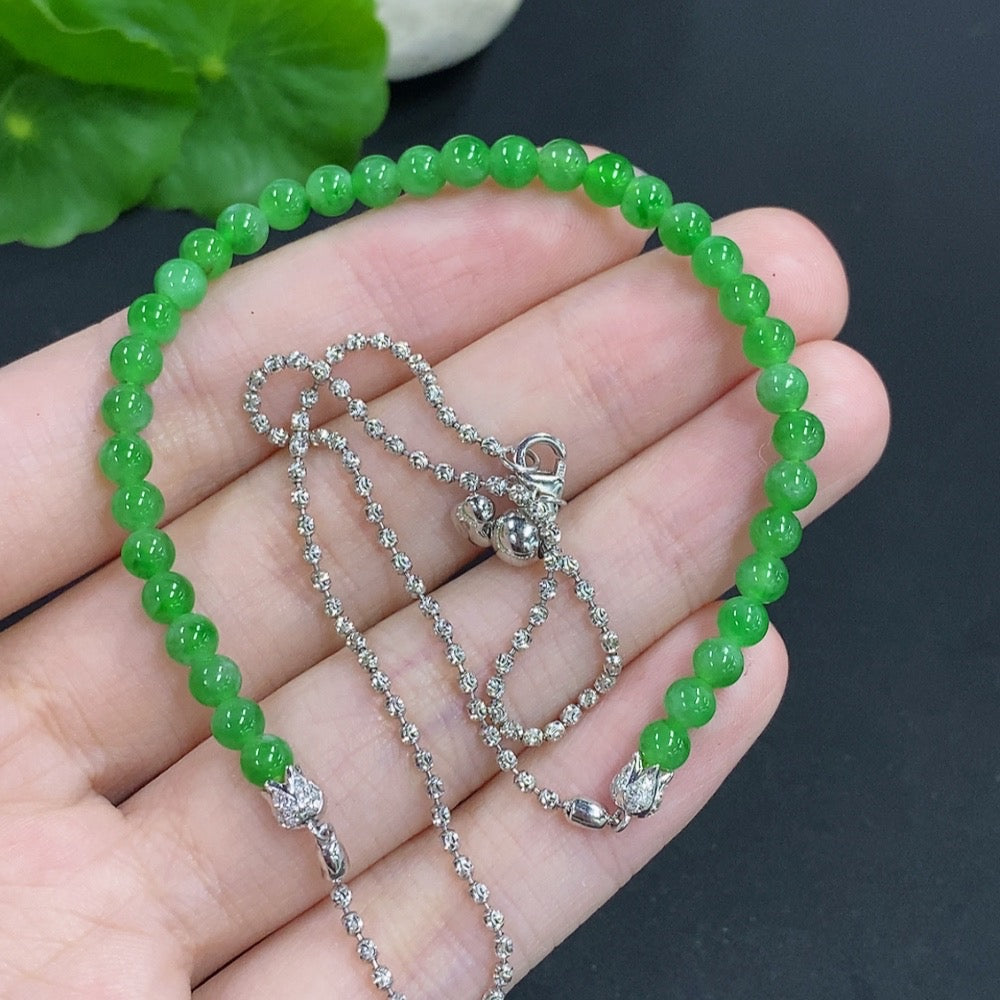 Jadeite single bezel pendant with 18k gold, accented with diamonds, about 3.9mm, weighing 8.1g including chain, by HKHQ.