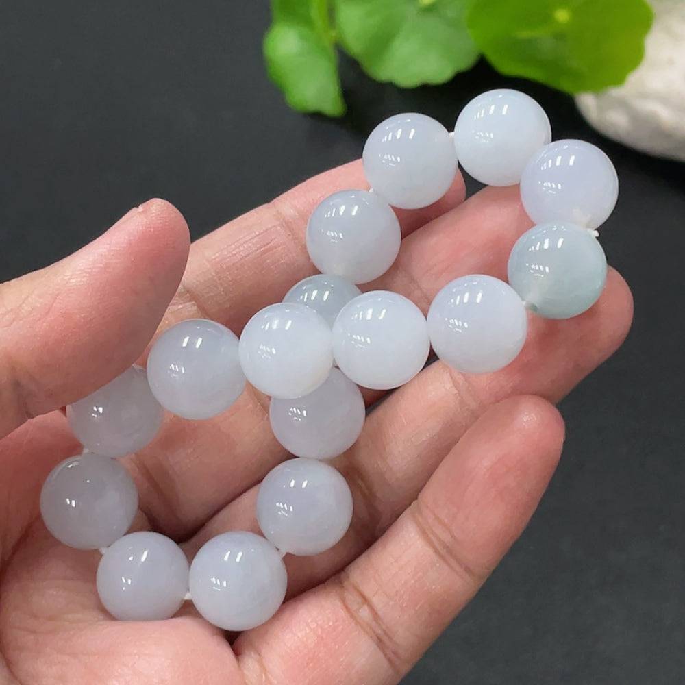 Huiliu Jadeite bracelet, 12.4mm round jade beads, certified by HUILIU HQ, displayed on a neutral background.