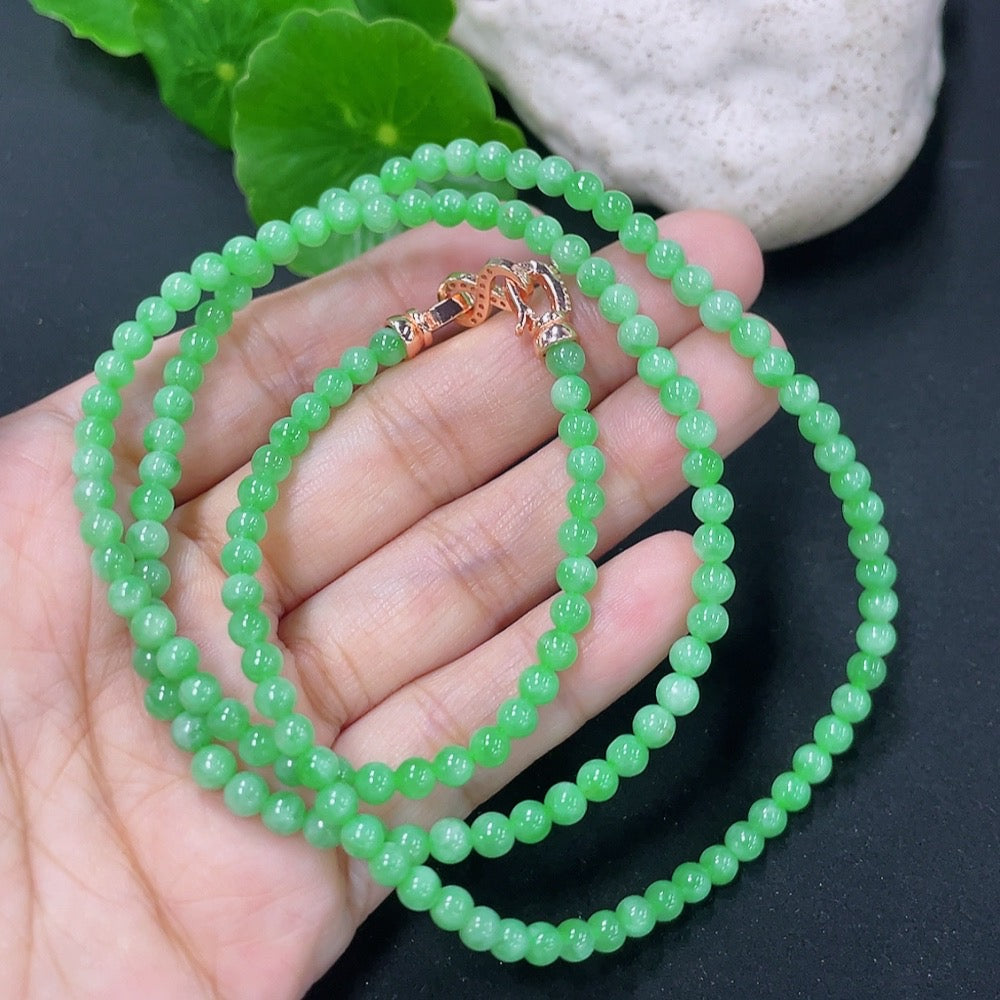 HKHQ jadeite bead necklace with non-gold clasp, weighing 17.87g, featuring smooth, polished green jade beads.
