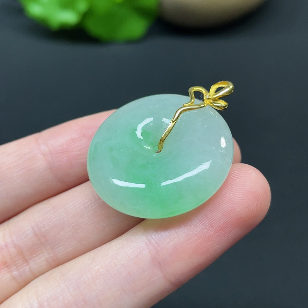 Jadeite Peace Knot pendant with 18k gold and diamond side stones, HKHQ, detailed close-up of the inlaid jade design.