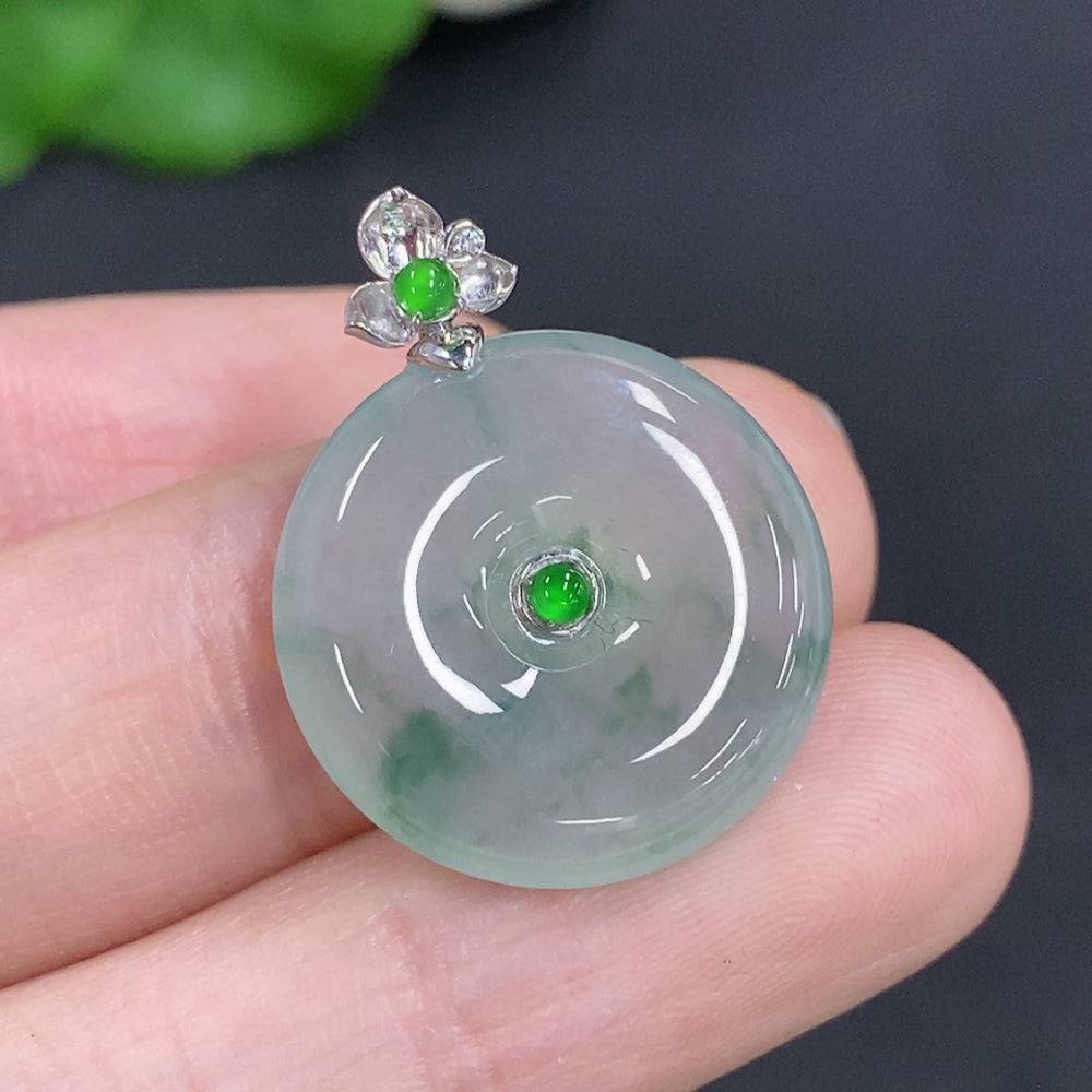 Jadeite peace knot pendant with 18K gold clasp, crafted from smooth green jade, weighs approximately 4 grams.