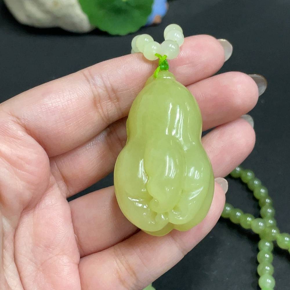 Huiliu Hetian Jade Pendant with bergamot on a chain, certified Huiliu HQ, showcasing smooth green jade and elegant design.