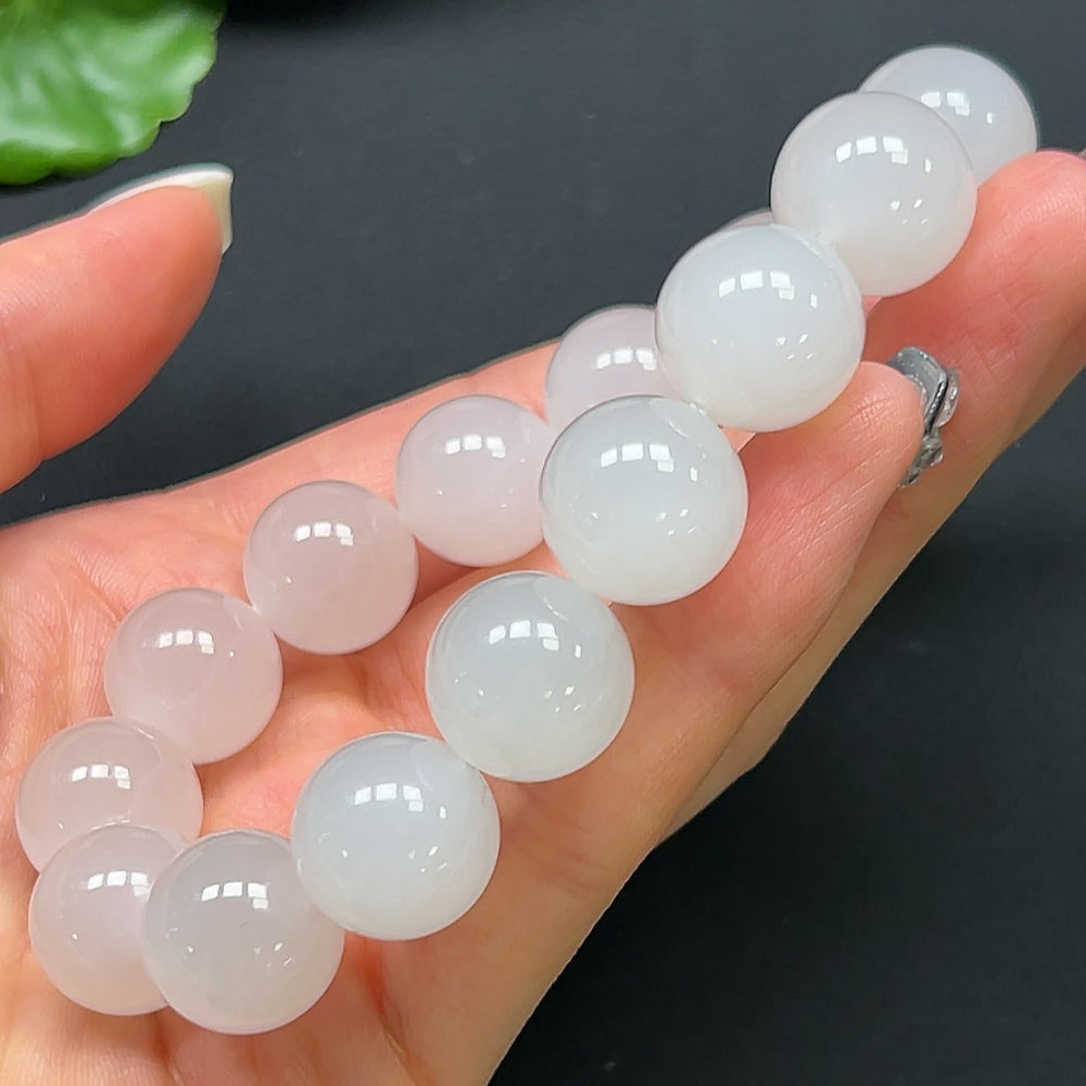 Hetian Jade bracelet by HKHQ featuring 14mm smooth, polished jade beads on a string for elegant jewelry display.