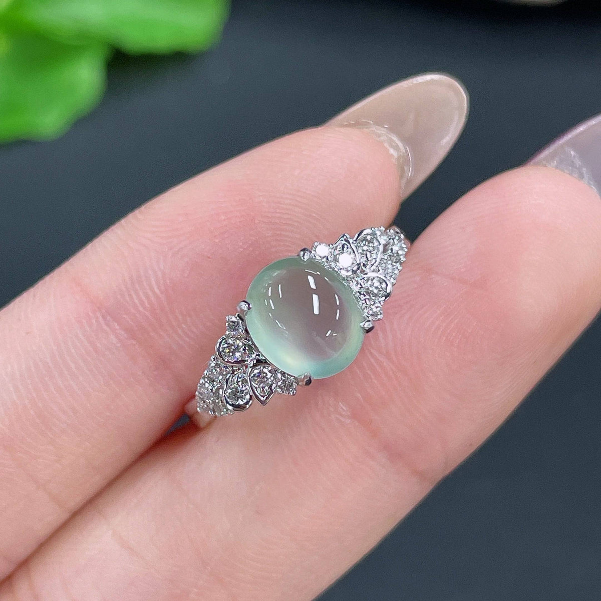 Jadeite ring with 18k gold setting and diamond accent, size 14, crafted by HUILIU HQ, showcasing the elegant jewelry design.