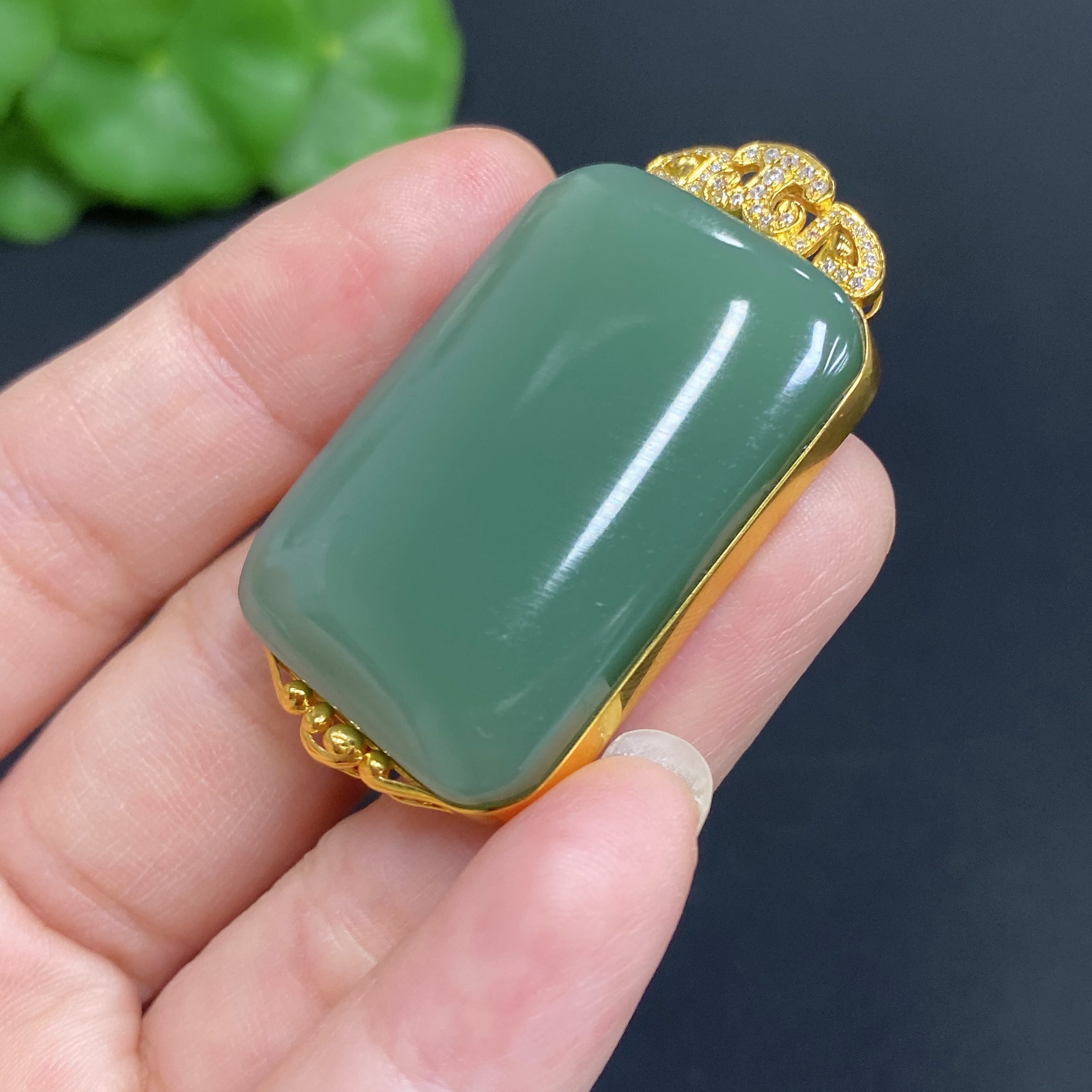 Hetian jade jasper pendant with 18k gold setting, plain design, weight approx. 18g, showcasing smooth, natural gemstone craftsmanship.