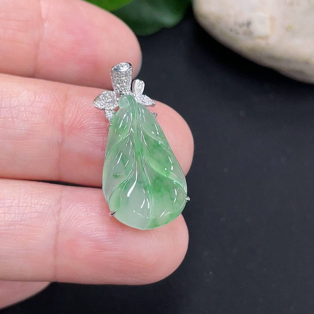 Large green jade gemstone from HUILIU HQ, showcasing its smooth, polished surface and vibrant color.
