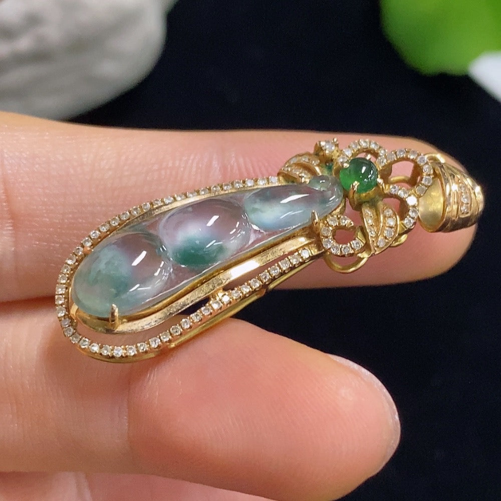 Jadeite auspicious bean pendant with 18k gold and diamond accents, showcasing intricate inlay design and polished finish.