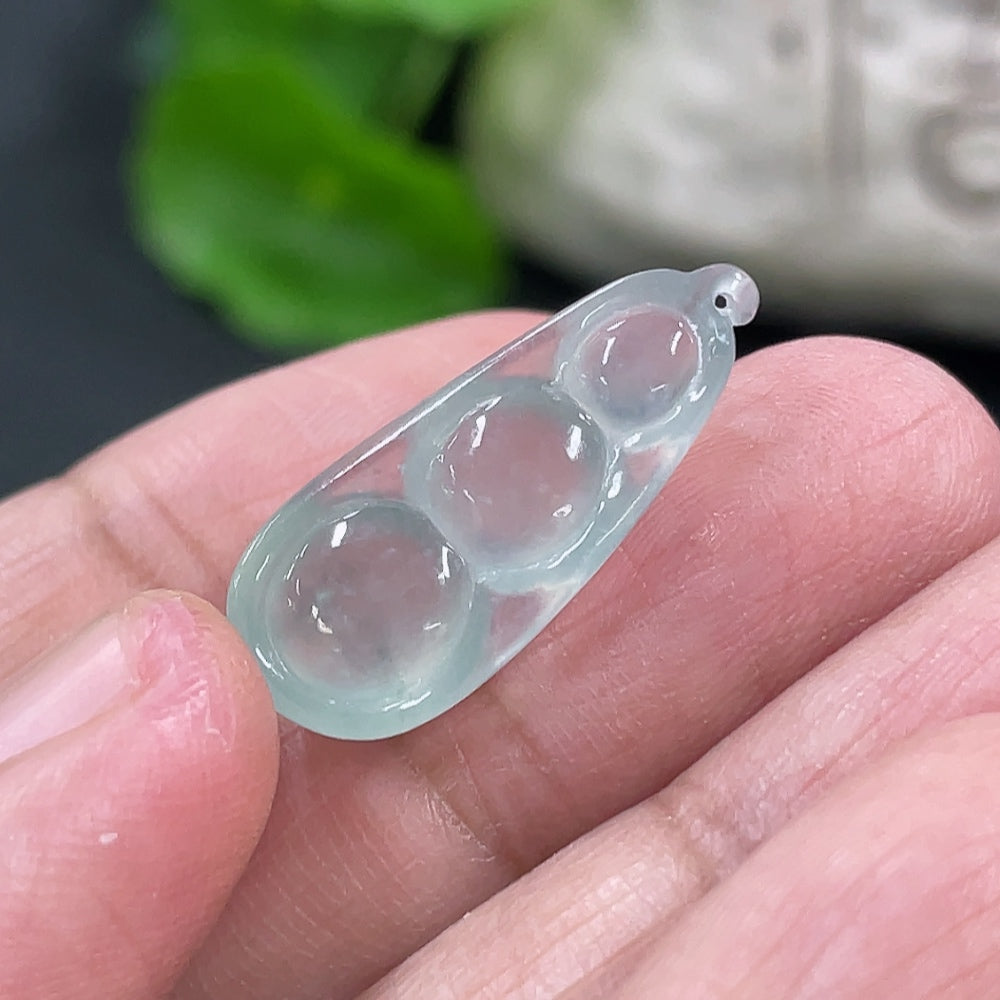 Jadeite auspicious bean inlay piece from HKHQ, with detailed green jade design, weighing approximately 1.88g.