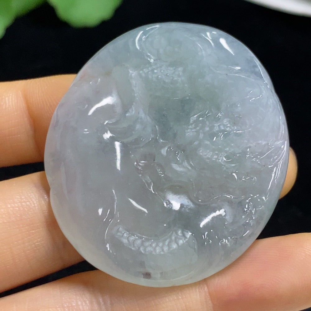 Jadeite pendant featuring a dragon design, crafted from jade, weighing approximately 33.56g, with intricate carved details.