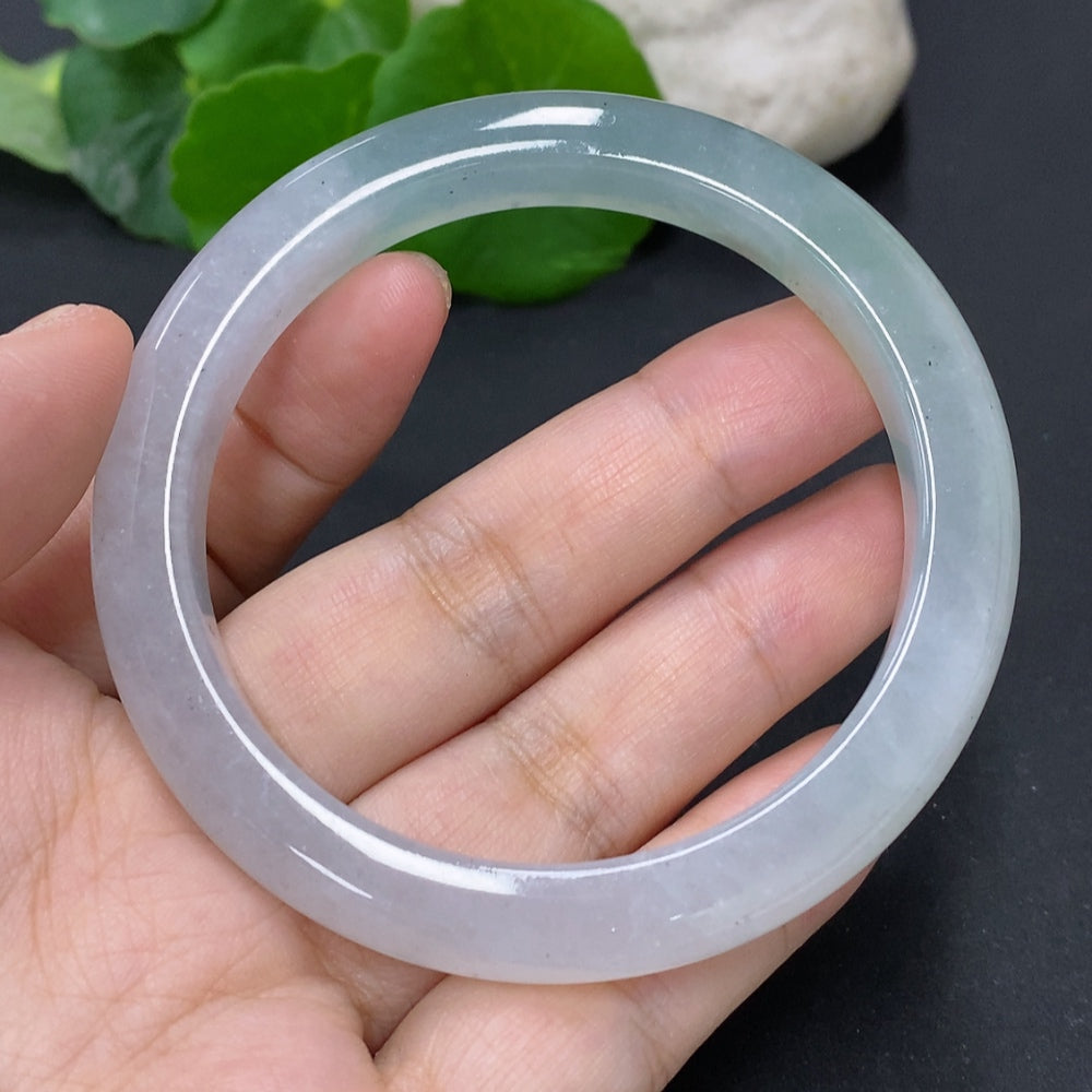 Jadeite round bangle in size 56.7 with approximately 44g weight, crafted by HKHQ, showcasing smooth, polished jade surface.