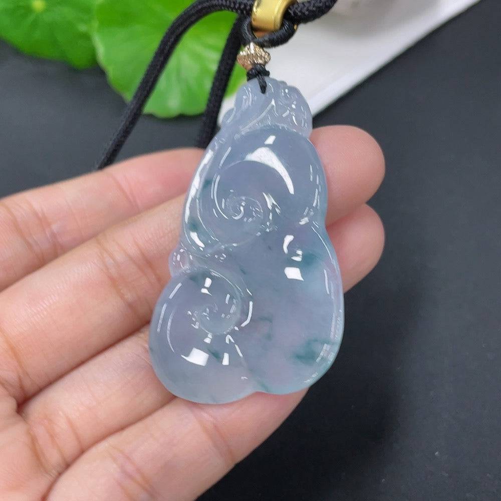 Jadeite pendant in Ruyi shape with rope, weighing approximately 15.72g, crafted by HUILIU HQ, showcasing smooth jade surface and intricate design.