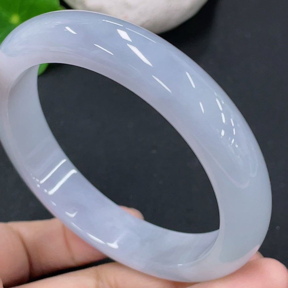 Huiliu Certified jadeite round bangle with smooth, polished surface showcasing vibrant green jade color.