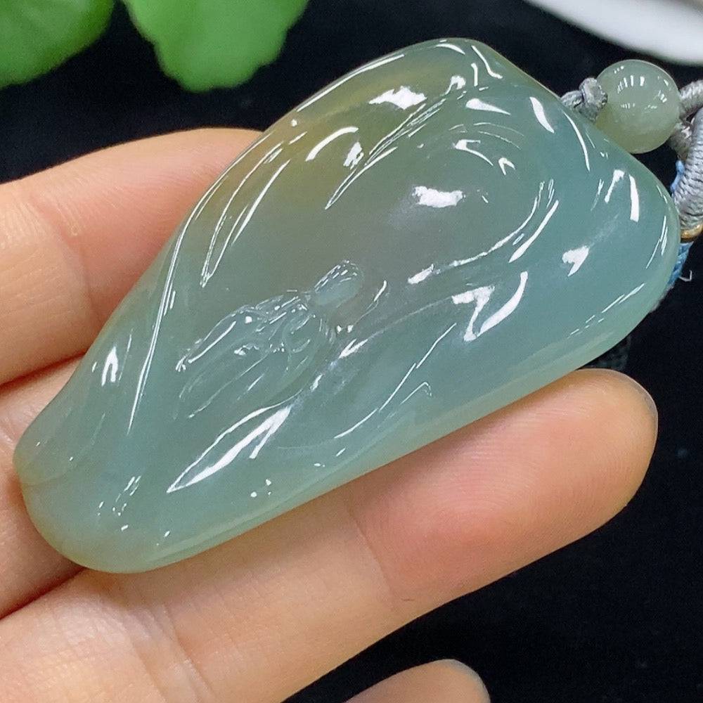 Jadeite Formless Pendant in green jade, crafted by HUILIU HQ, showcasing smooth, organic shape and polished surface.