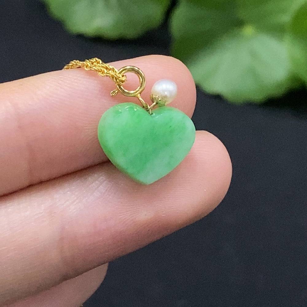 Jadeite heart pendant necklace in 18K gold with chain, featuring a smooth green jade heart, weighs approximately 1.63 grams.