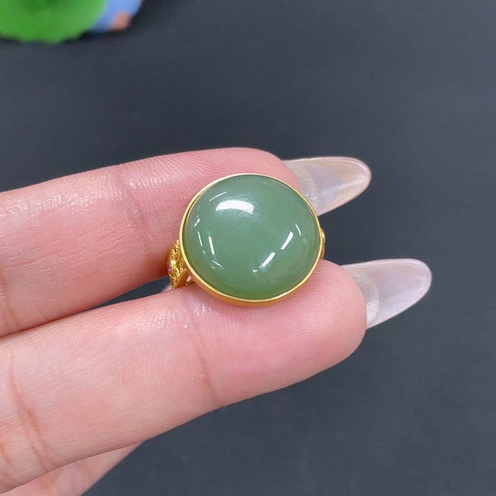 Huiliu certified Hetian Jade inlaid ring with intricate jade design and silver band, showcasing craftsmanship and elegant jewelry style.