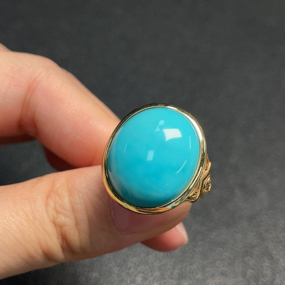 Huiliu certified turquoise gemstone ring with no hallmark, showcasing a vibrant blue-green gemstone on a silver band.