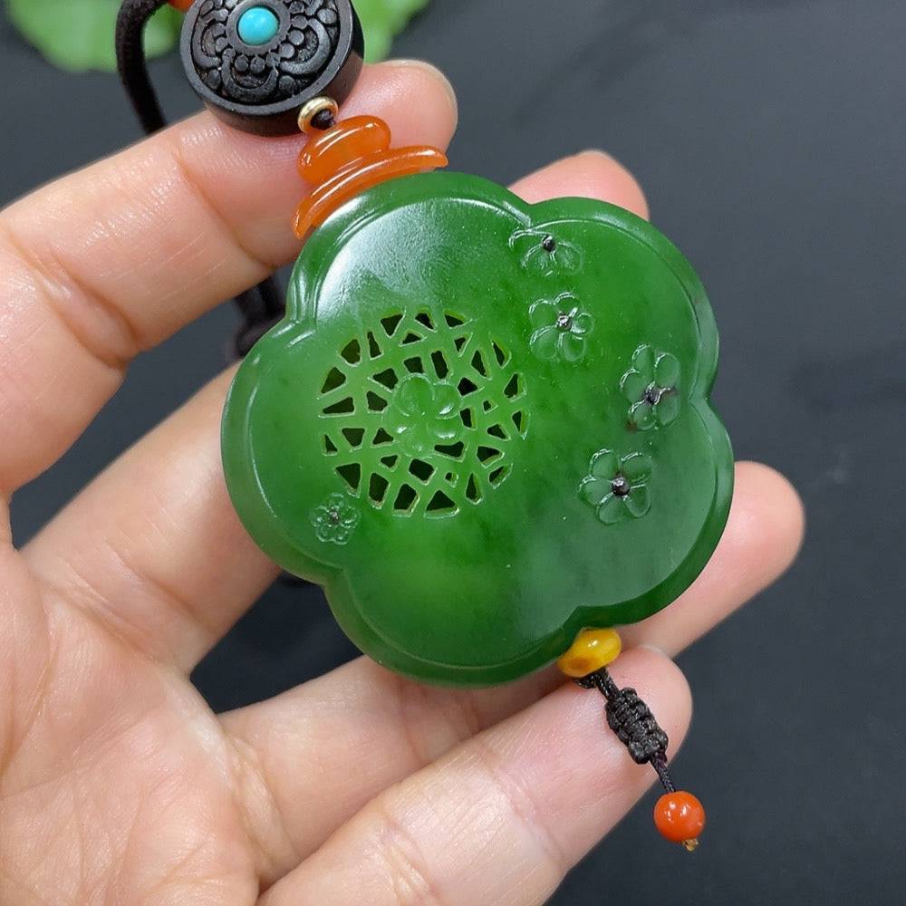 HUILIU HQ Hetian Jade Jasper pendant featuring blooming flowers and symbols of wealth, showcasing intricate craftsmanship and natural jade colors.