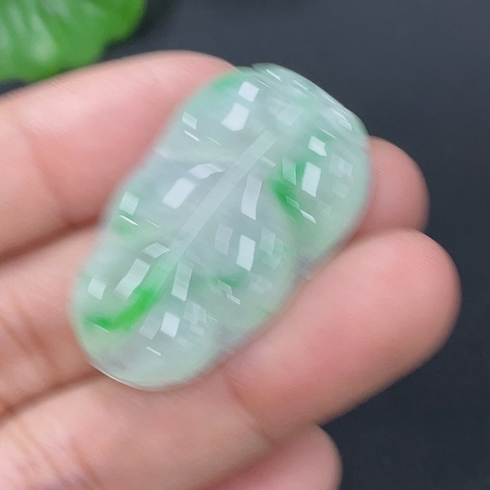 Huiliu Jadeite pendant shaped like a leaf, certified jade jewelry with intricate natural green jade stone details.