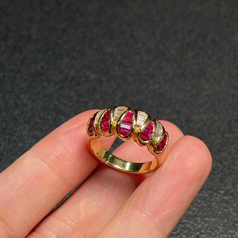 Huiliu Ruby ring with diamond accents featuring vibrant red gemstones and sparkling diamonds on a silver band.