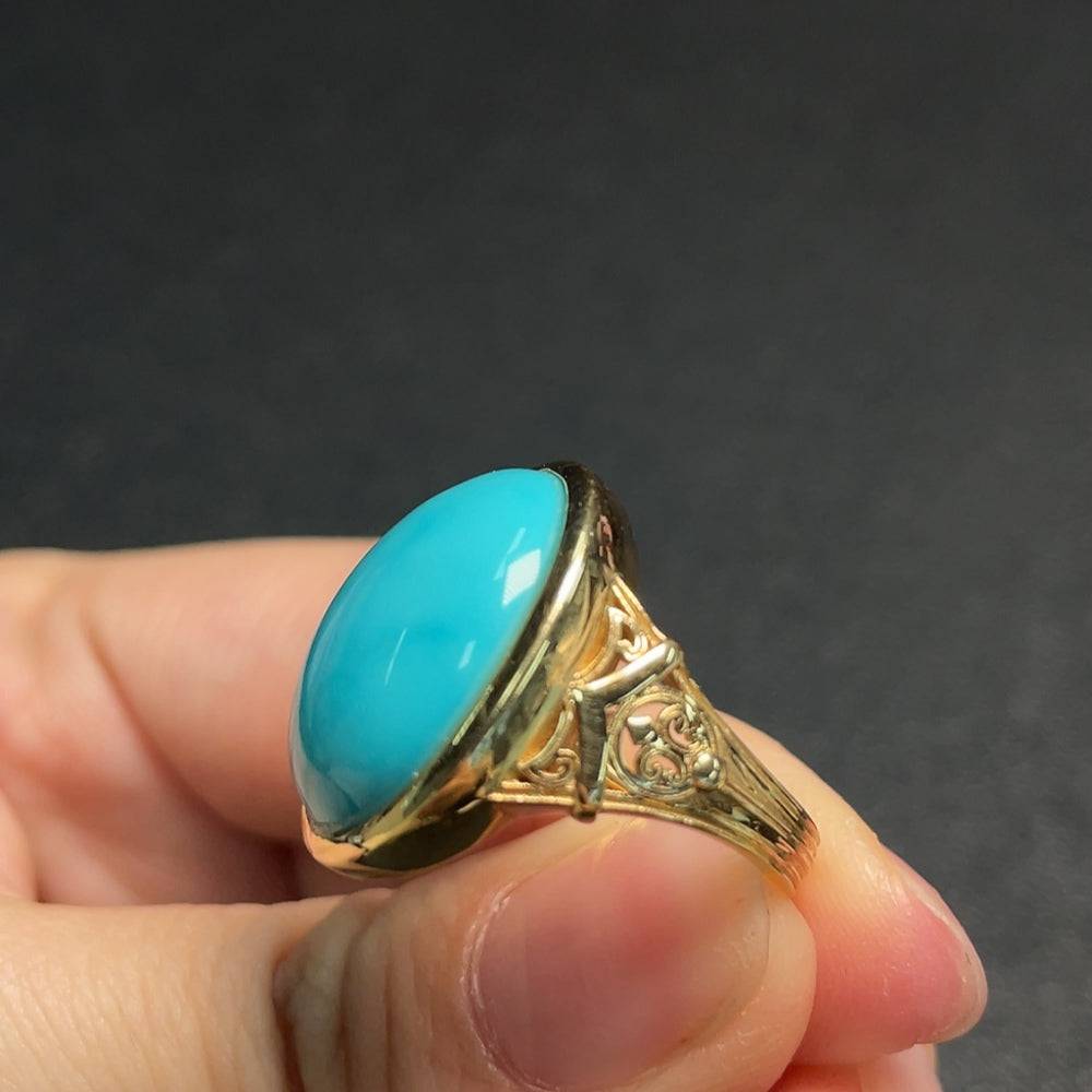 Huiliu certified turquoise gemstone ring with a smooth silver band, featuring a vibrant, undetermined color turquoise stone.