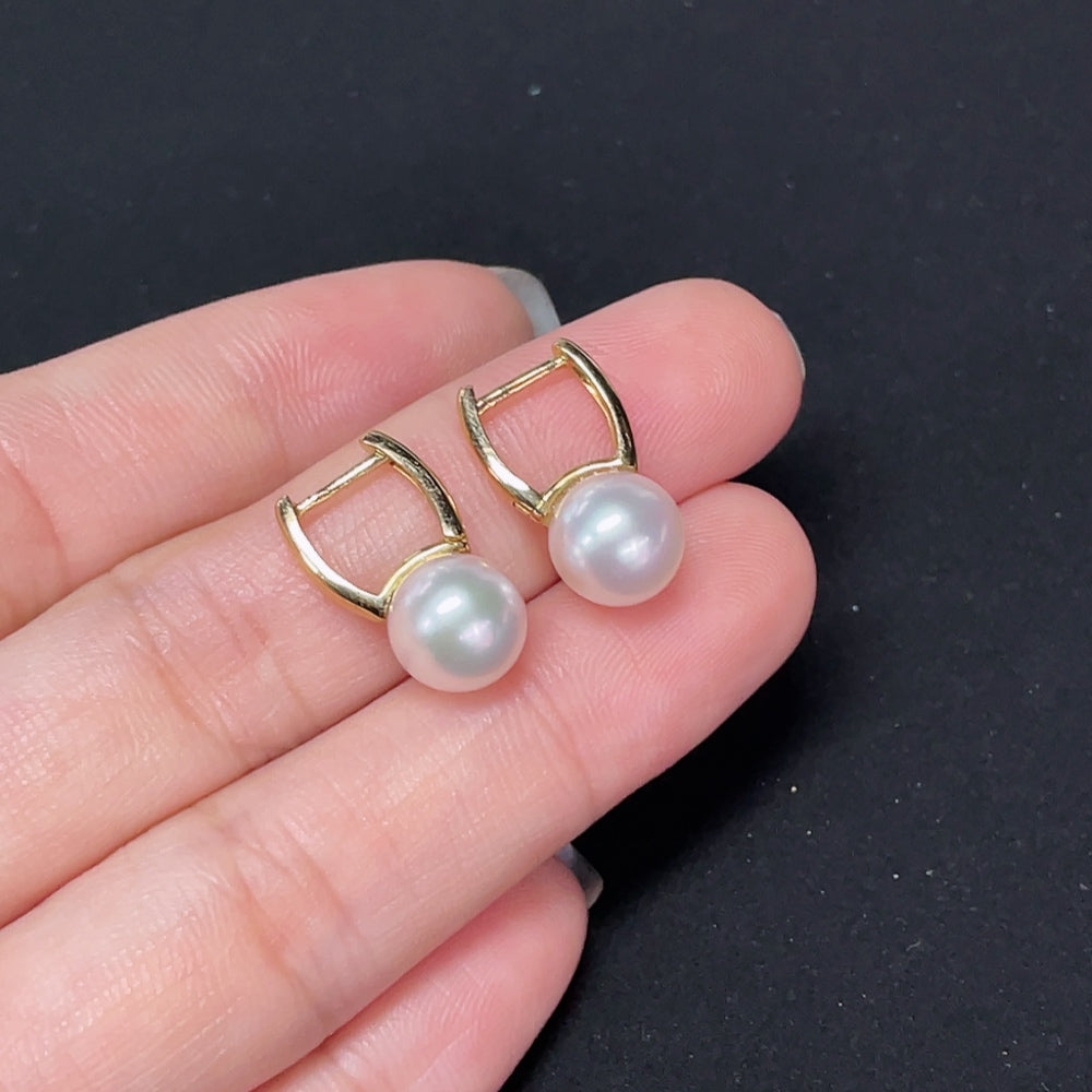 Saltwater pearl earrings with 18K gold setting from HKHQ, featuring elegant round pearls on classic gold hooks.