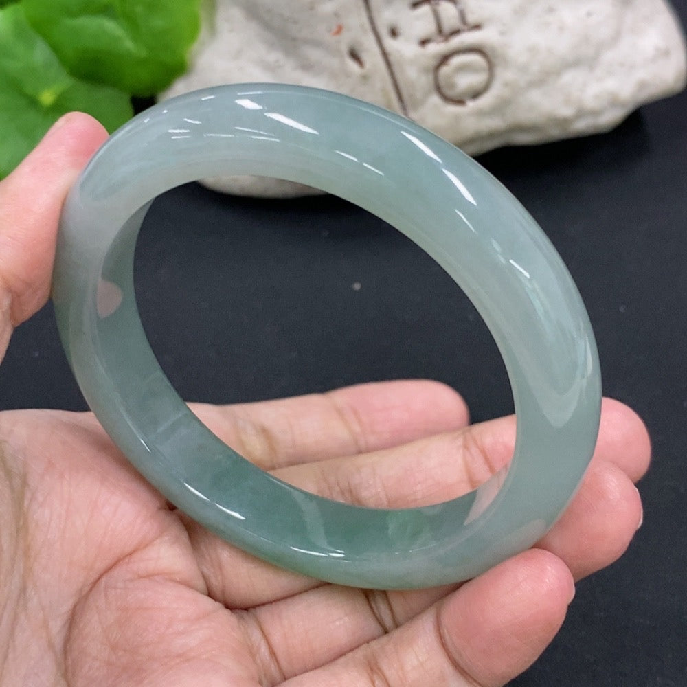 HKHQ jadeite round bangle in size 55.5, weighing 53.26g, showcasing smooth, polished green jadeite bracelet on white background.