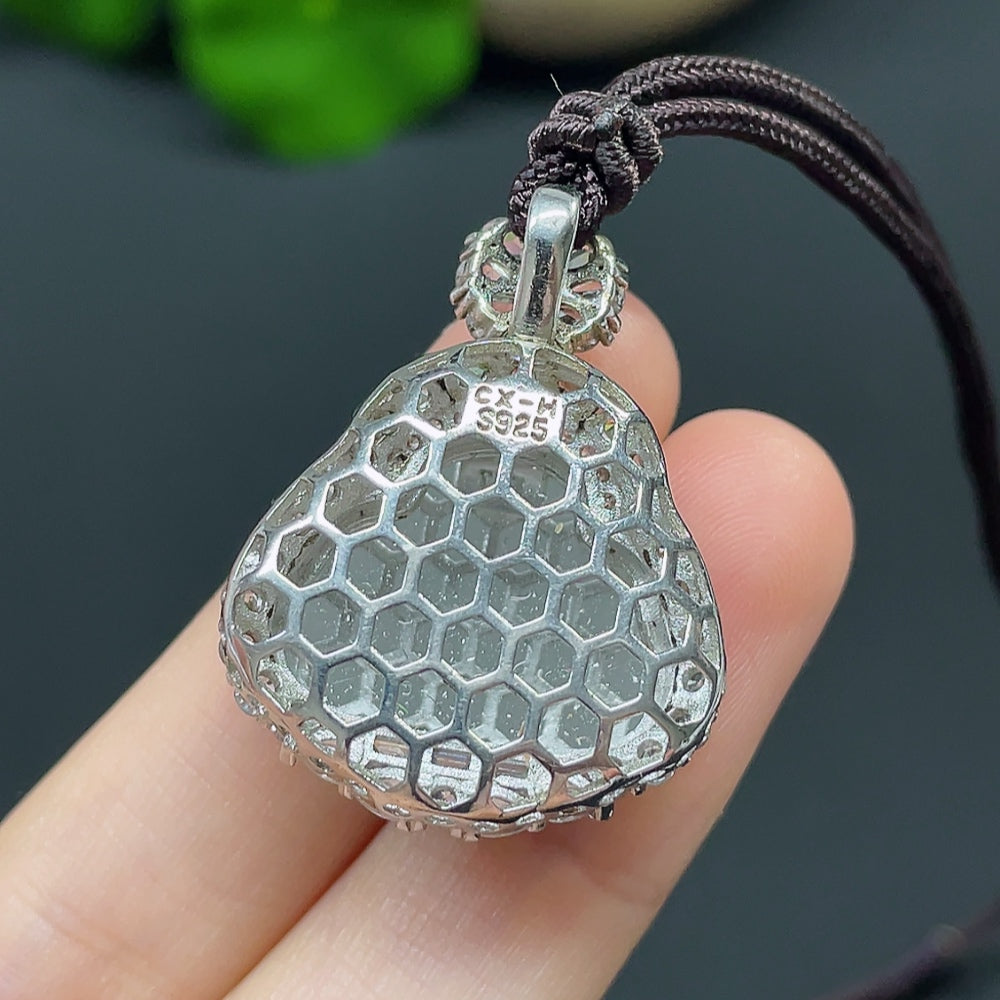 Jadeite Buddha pendant necklace with non-gold setting, featuring a detailed jade Buddha charm on a sleek chain.