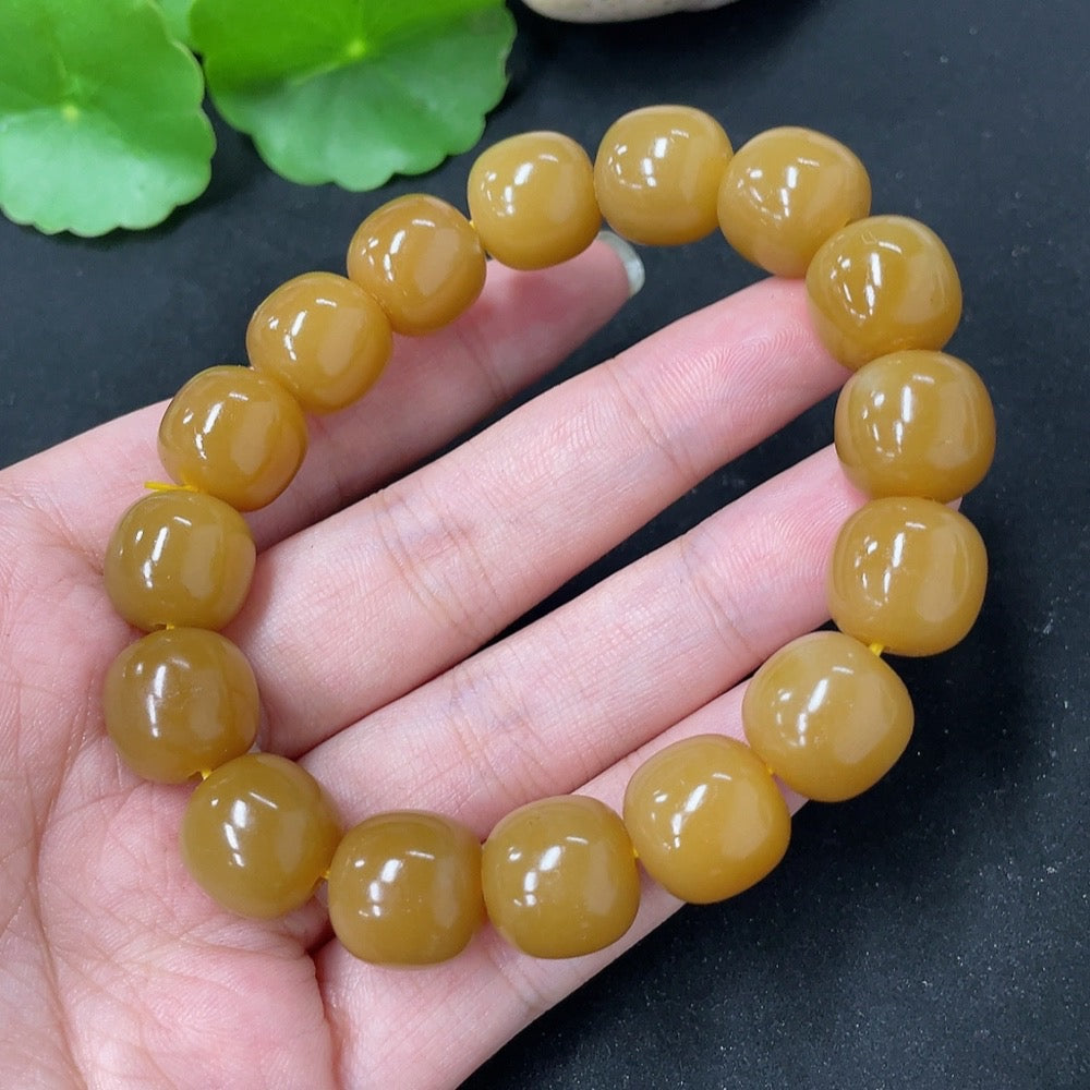 HKHQ Hetian Jade bracelet weighing 58.5g, featuring smooth, polished green jade beads on a stretchy string.