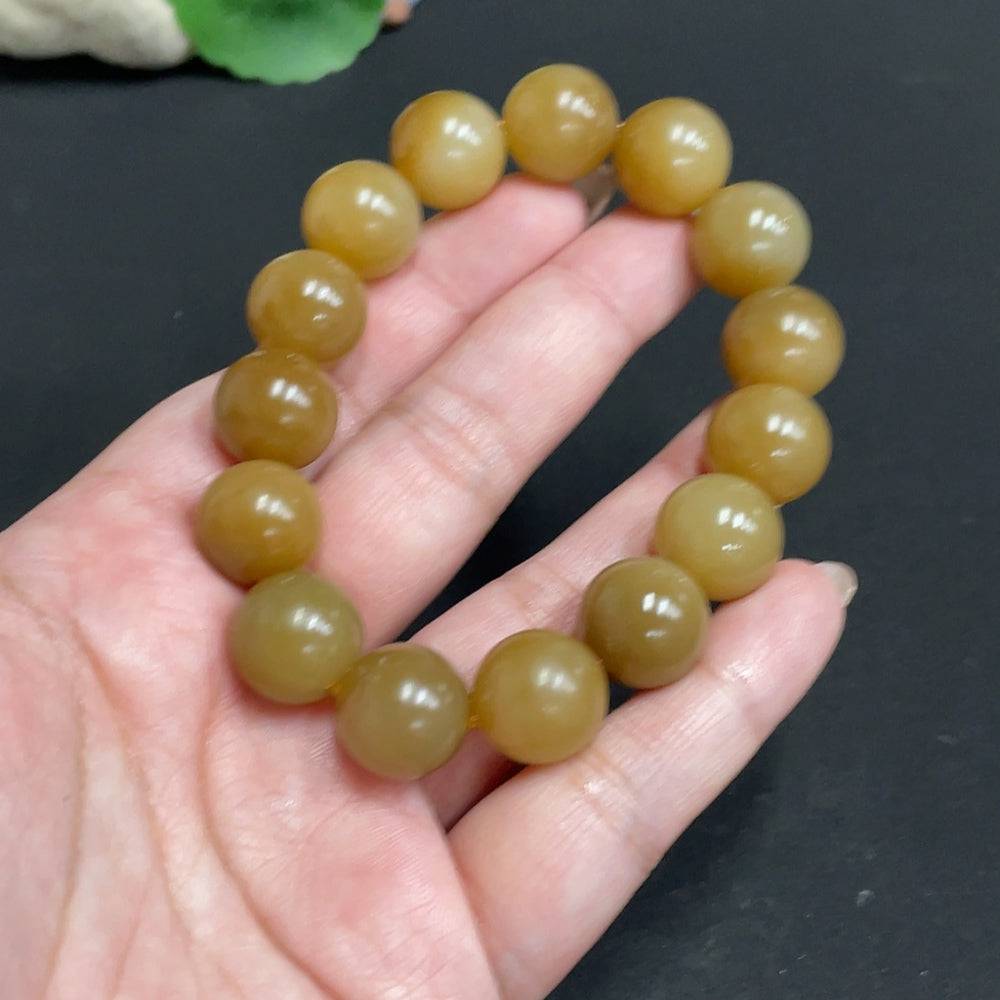 Hetian jade bracelet with 13.9mm beads, weighing approximately 65.4g, featuring smooth, polished jade stones from HUILIU HQ.