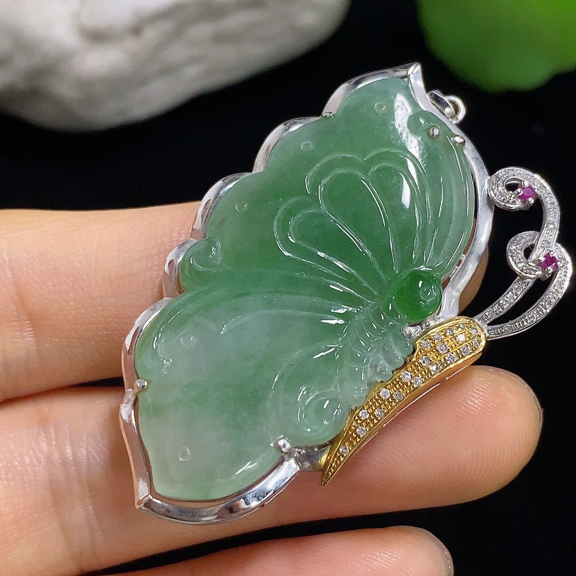 Jadeite butterfly pendant with 18k gold accents and diamond details, showcasing a delicate design and vibrant green jade stone.