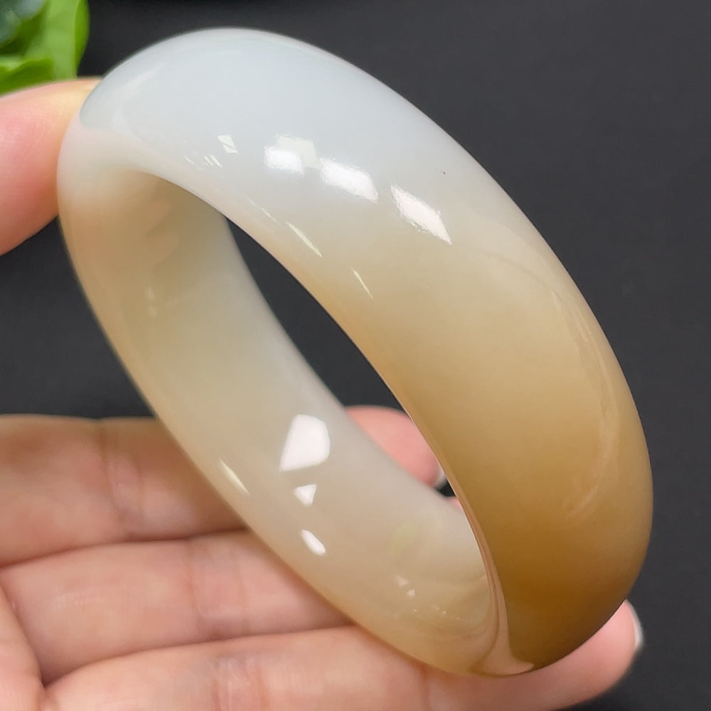 HKHQ Hetian Jade round bangle, size 55.2, weighs 83.44g, featuring smooth polished surface and traditional craftsmanship.