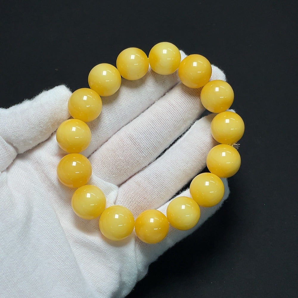 Amber Beeswax bracelet with 13.9mm beads, weighing approximately 23.61g, featuring natural amber beads from HKHQ.