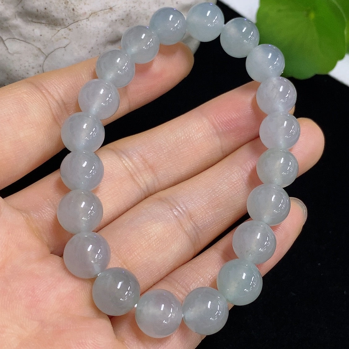 HKHQ jadeite bracelet weighing 28.68g, featuring smooth, polished jadeite stones arranged in a stylish bracelet design.