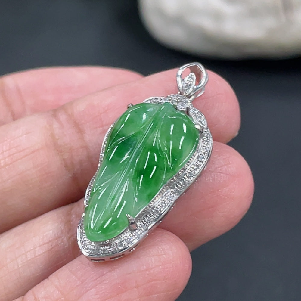 Jadeite leaf inlay pendant with 18k gold and diamond accents, weighing approximately 3g, crafted by HKHQ.
