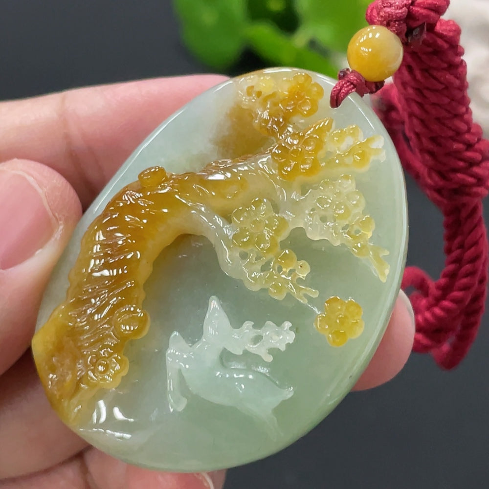 Huiliu Jadeite deer pendant featuring a smooth, polished jade surface with detailed carved antlers and a natural green hue.