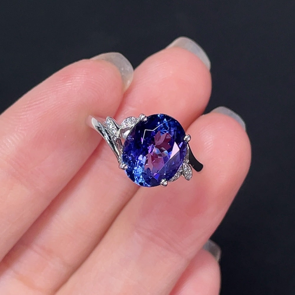 Elegant Tanzanite ring with 18K gold band, featuring a vibrant blue gemstone, by HKHQ.