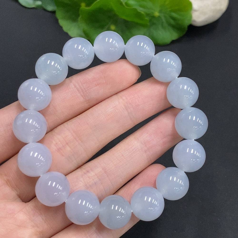 HUILIU HQ jadeite bracelet with 12mm beads, approximately 50.3g, showcasing smooth, polished jade stones on a white background.
