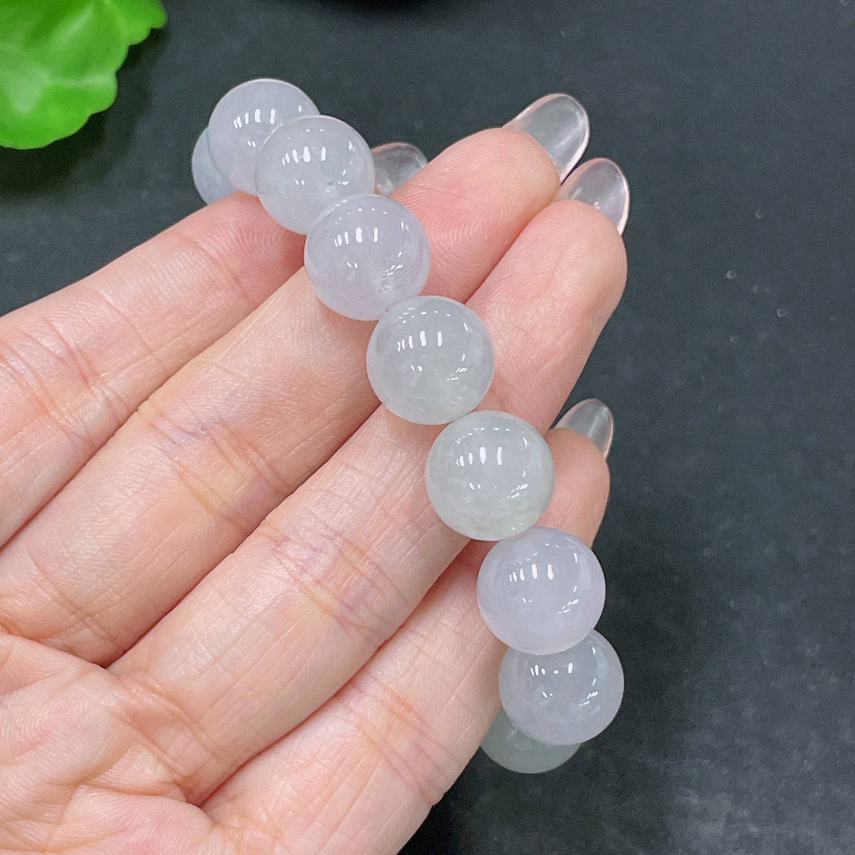 Huiliu jadeite bracelet with 12.3mm size, featuring smooth, polished jade stones in natural green hue.